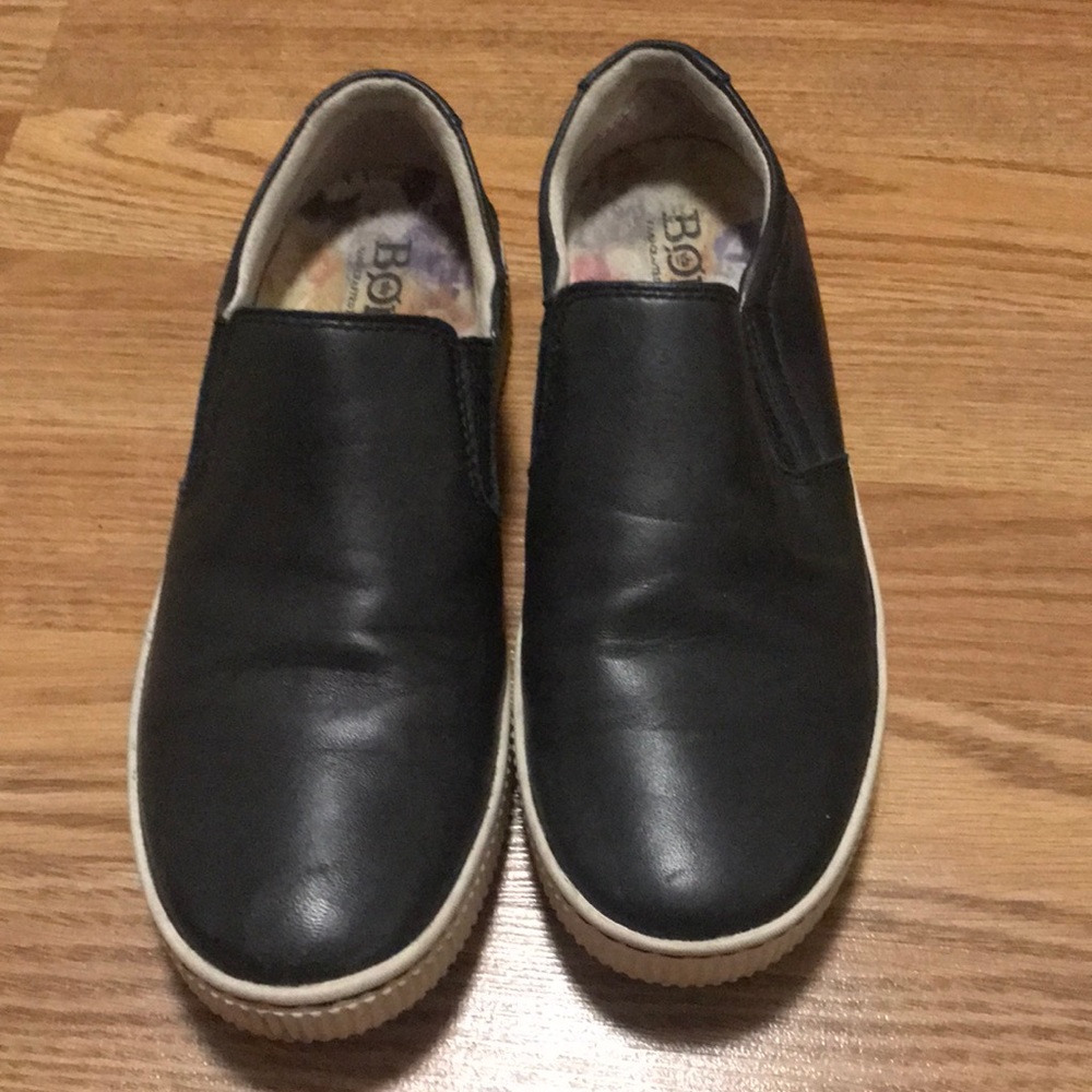 Black slip on shoes.